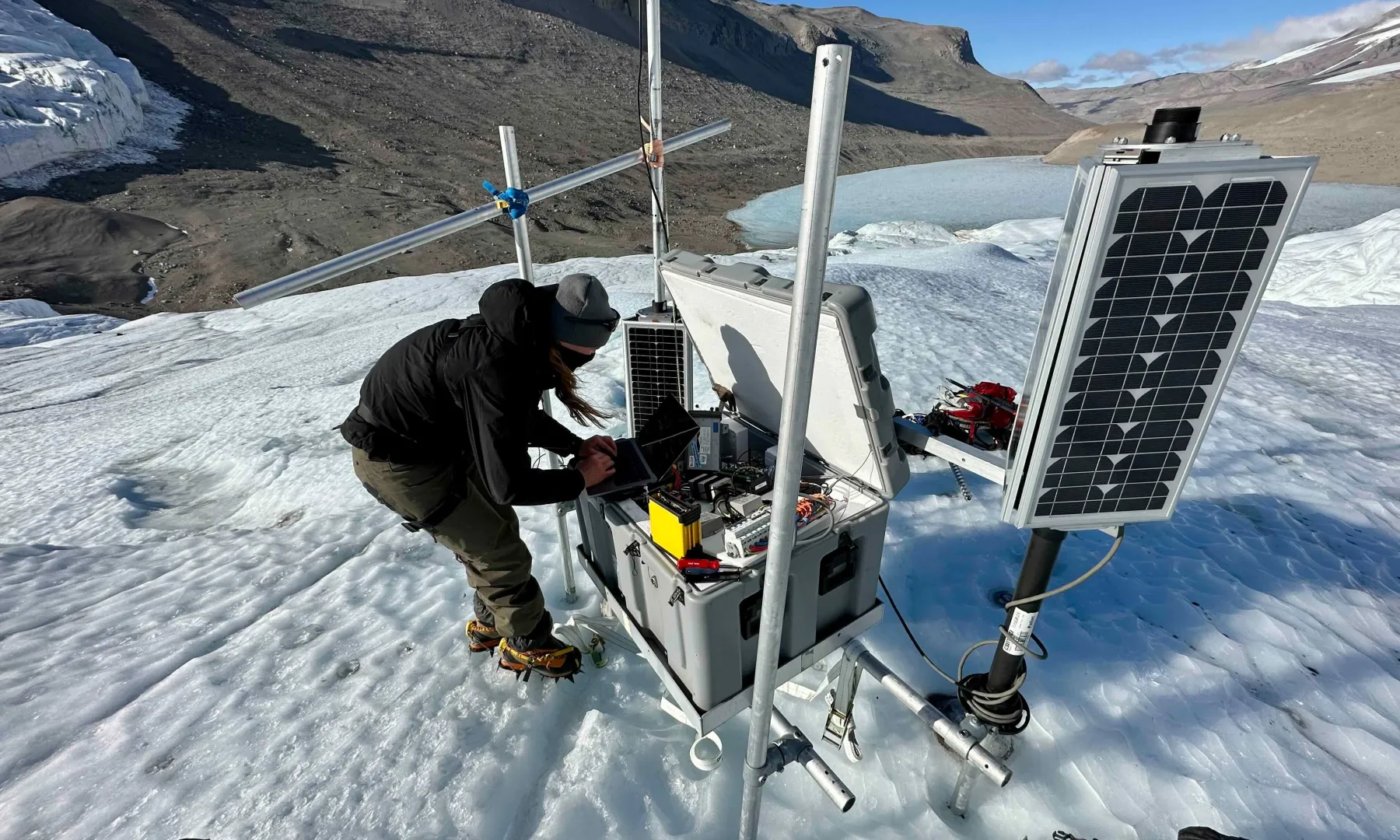 A seismometer being installed in the field.