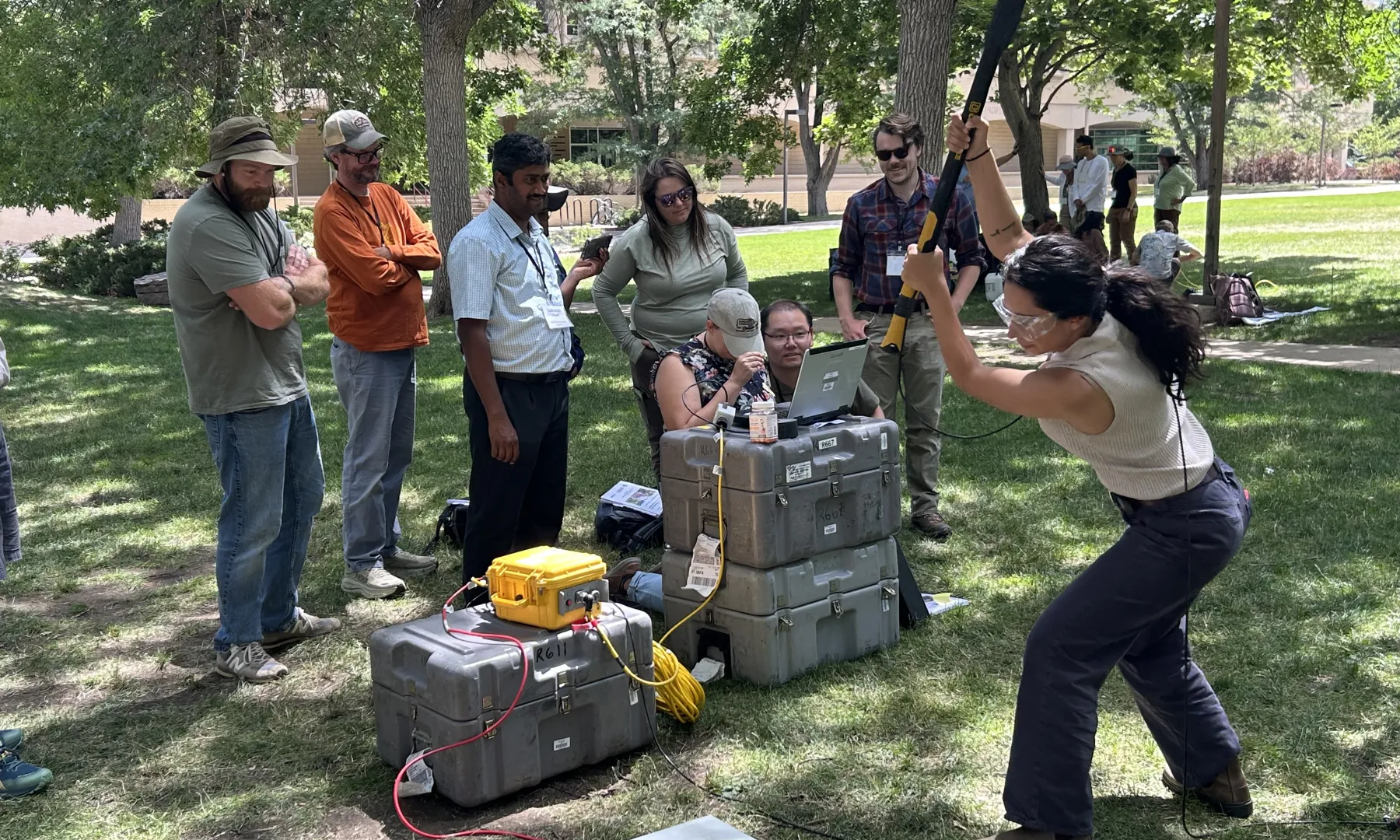 A seismometer being installed in the field.