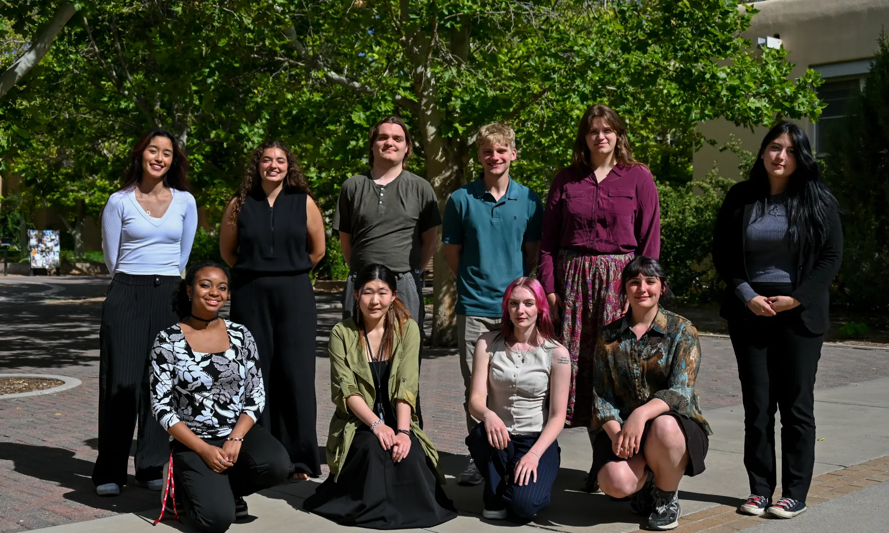 A group of interns make silly faces in front of Mount St. Helens