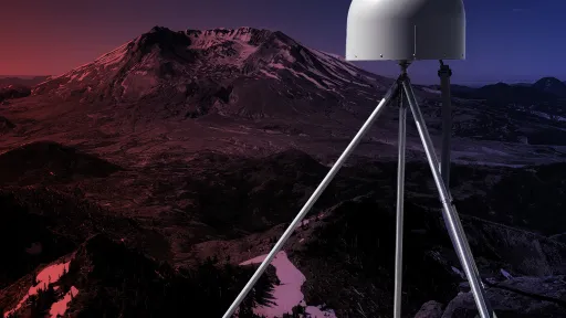 Photo of GPS station antenna in foreground and Mount St. Helens in the distance.