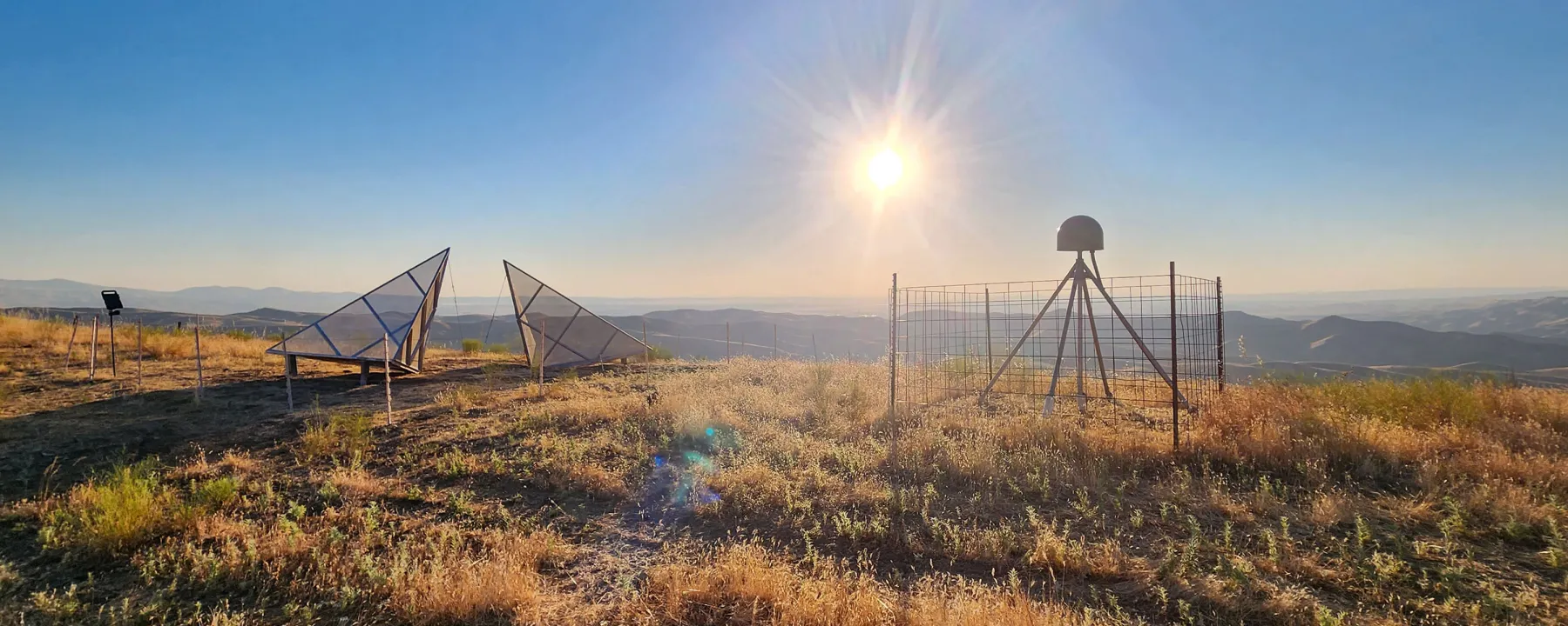 SAR satellite corner reflectors and a GPS station in California, with the Sun low in the sky.