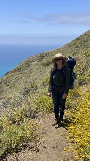 Luise walking on a trail in Big Sur, California.