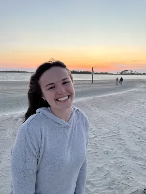 Headshot of Bailey Fitzgerald smiling on the beach.
