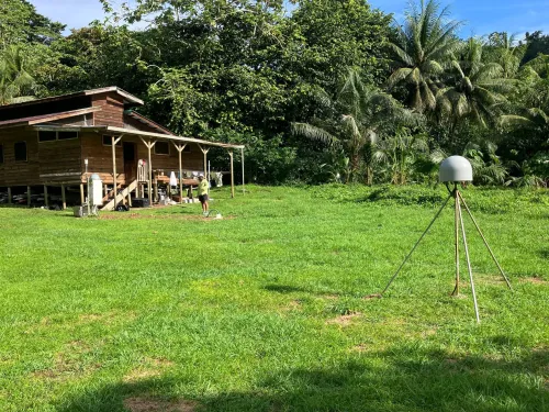 Image of ISCO station on Cocos Island. The GPS station is in the foreground, with the tower containing all the additional instrumentation and power supply in the background. 