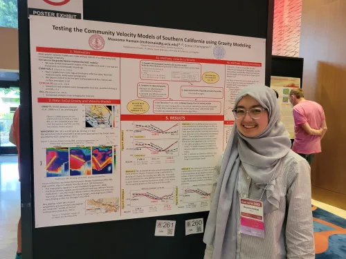Masooma standing in front of her poster on Testing the Community Velocity Models of Southern California using Gravity Modeling. 