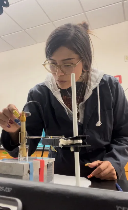 Kaissa using laboratory instruments to analyze data.