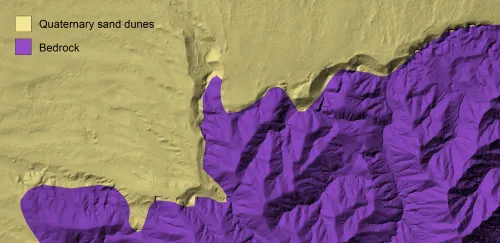 lidar hillshade with yellow and purple overlain colors delineating mapped sand dunes and bedrock