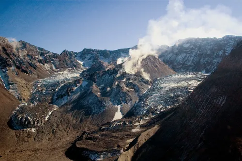 The crater of Mount St. Helens with a resurgent dome, fumarole, and glacier. 
